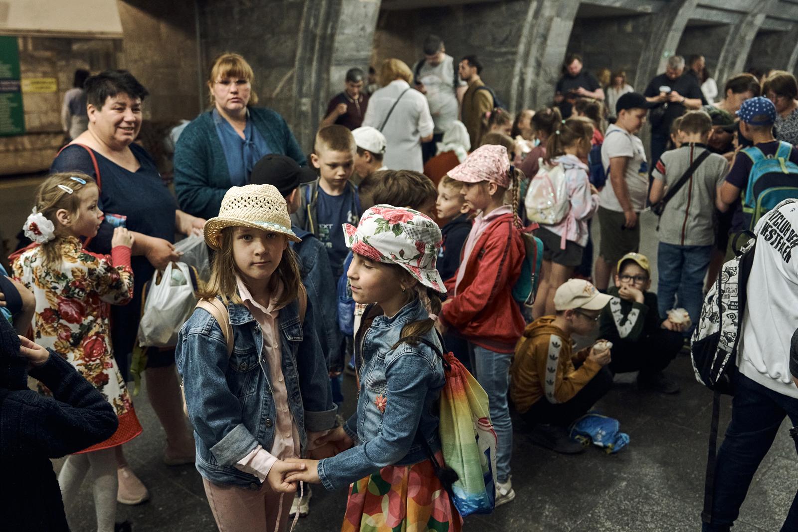 Schoolchildren hide in metro station in Kyiv during a Russian rocket attack. Photos by Kostiantyn Liberov and Vlada Liberova